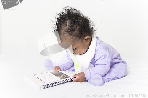 Image of Baby reading a book