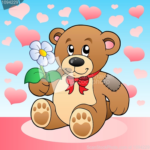 Image of Teddy bear with flower and hearts