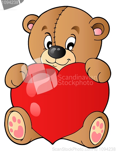 Image of Cute teddy bear holding heart