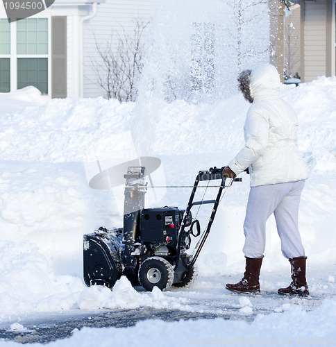 Image of Woman Blowing Snow