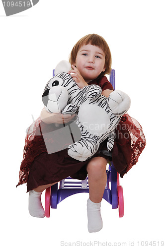 Image of Little girl with toy.