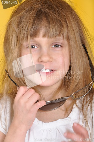 Image of child with broken sunglasses