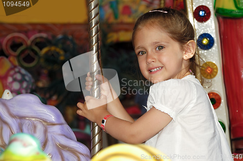 Image of Child in carousel