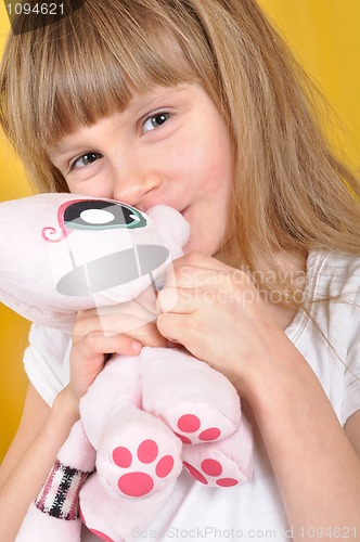 Image of child with a toy cat