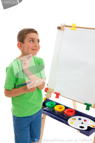 Image of Young artist contemplates what do paint