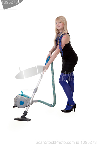 Image of The girl in blue tights with a vacuum cleaner