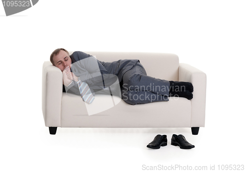 Image of businessman sleeping on a sofa