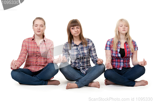 Image of Three girls sitting in lotus posture