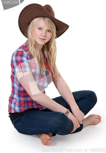 Image of Beautiful girl in a cowboy hat