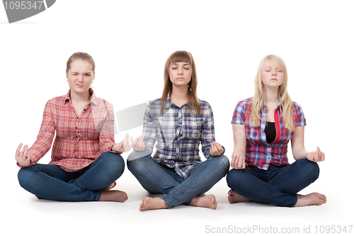 Image of Three girls sitting in lotus posture