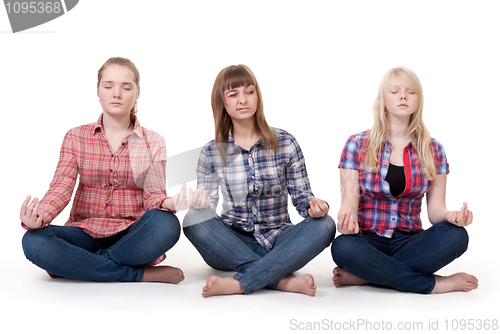 Image of Three girls sitting in lotus posture