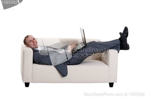Image of businessman lying on the couch