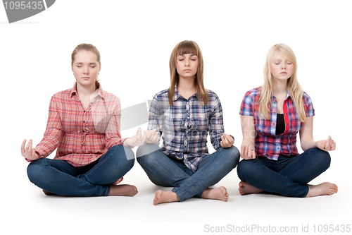 Image of Three girls sitting in lotus posture