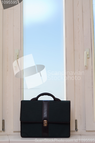 Image of briefcase near a window