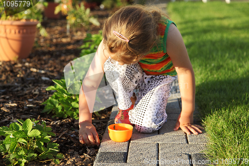 Image of Child helping in garden