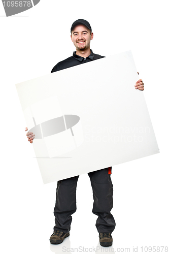 Image of smiling worker with board