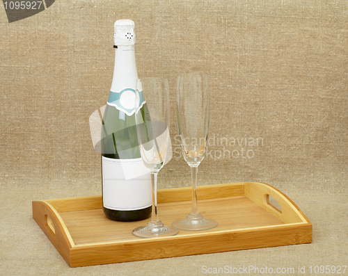 Image of Champagne wine and glasses on wooden tray