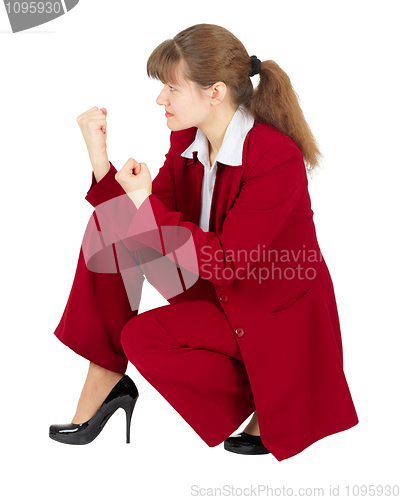 Image of Woman sitting in combat stance