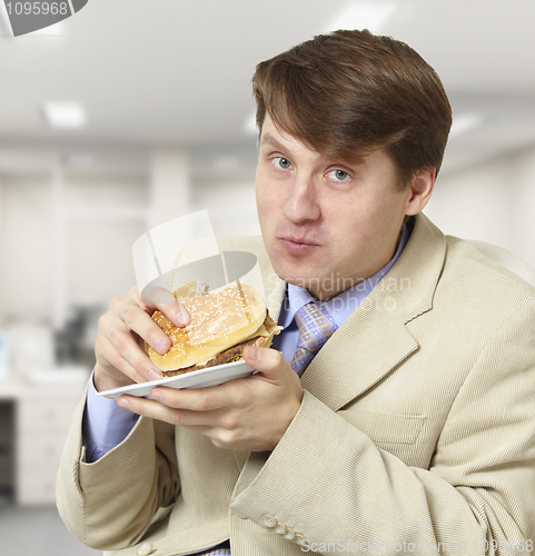 Image of Young businessman is the dinner