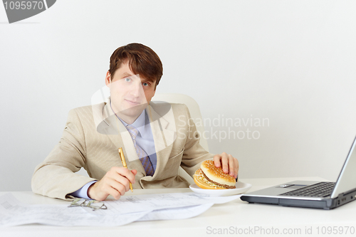 Image of Businessman is going to eat delicious sandwich without interrupt