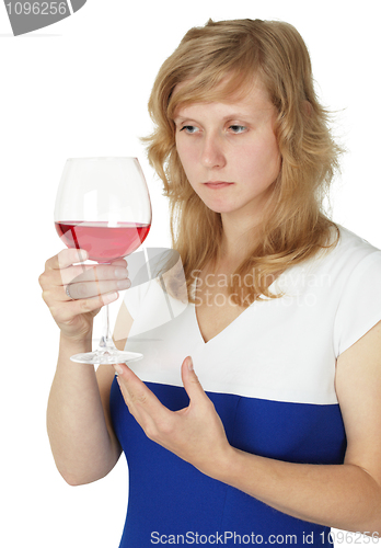 Image of Woman holding glass of red wine on white