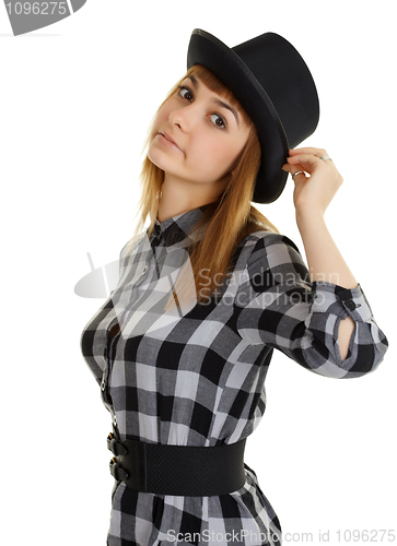 Image of Beautiful young woman in black hat posing on white