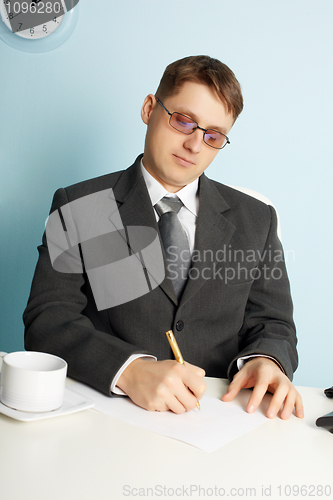 Image of Businessman working in workplace in office