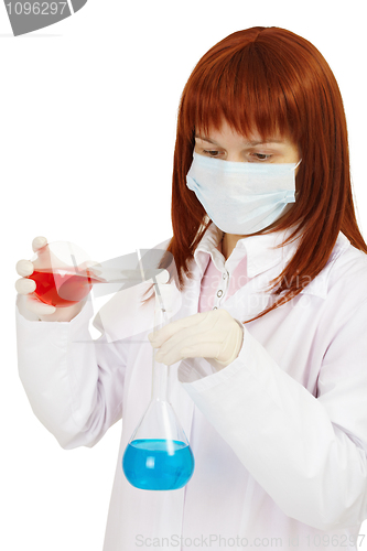 Image of Woman - scientist mixes poisonous solutions