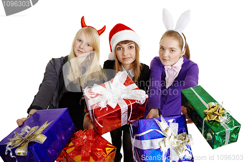 Image of Three girls hand over New Year's gifts