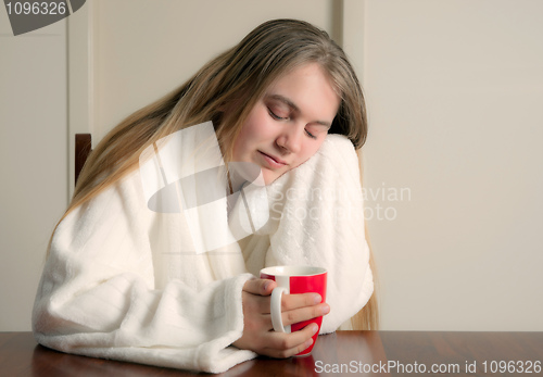 Image of tired woman coffee in the morning