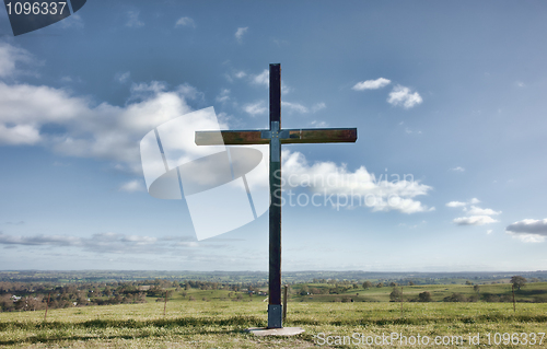 Image of christian cross of christ in field