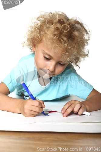 Image of kid drawing on floor