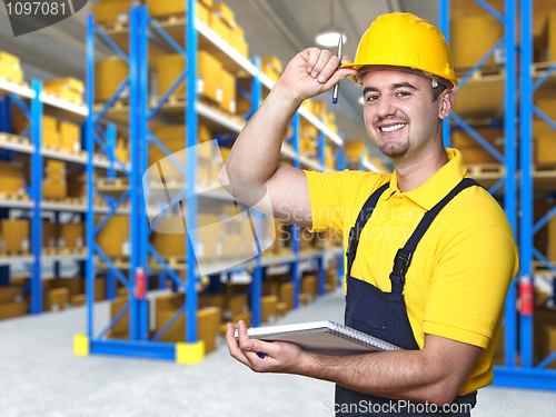 Image of smiling worker in warehouse