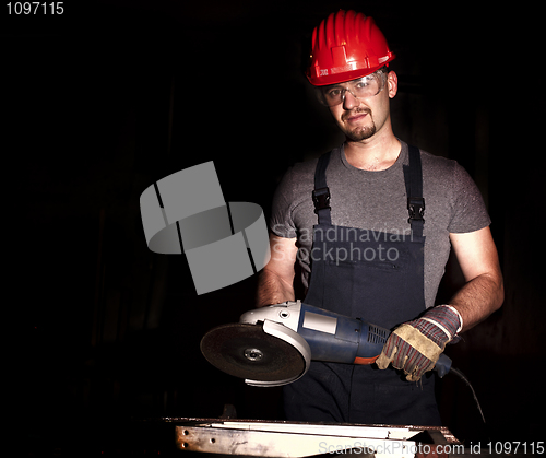 Image of manual worker with grinder