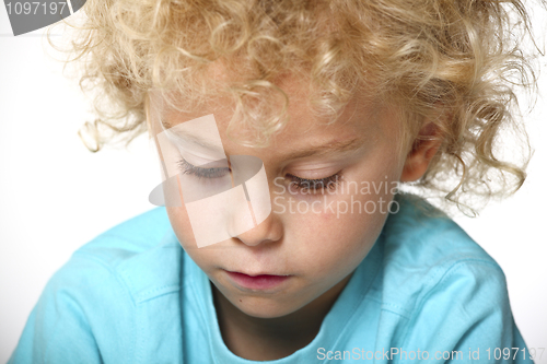 Image of closeup portrait of blonde kid