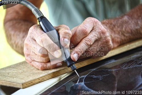 Image of craftman at work detail