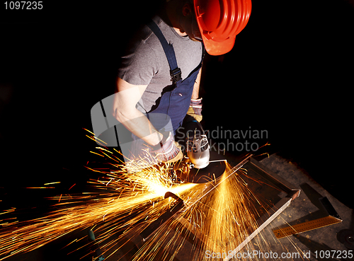 Image of manual worker with grinder