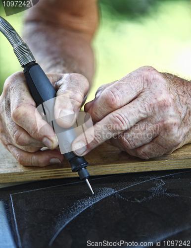 Image of craftman at work detail