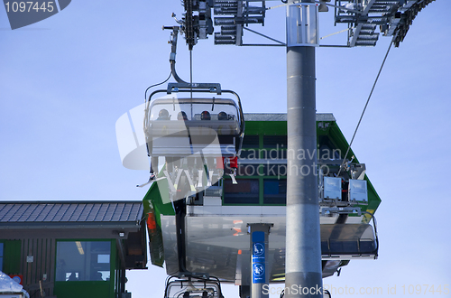 Image of skiing people in ski lift