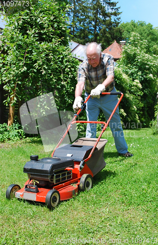 Image of man with lawn mower