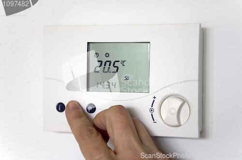 Image of hand thermostat