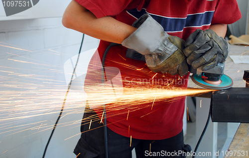 Image of worker with grinder