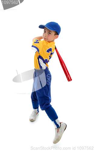 Image of Young child swinging a baseball bat