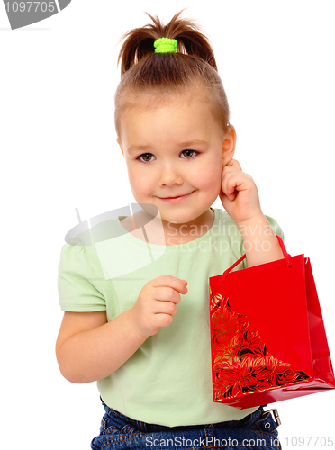 Image of Cute little girl with red shopping bag