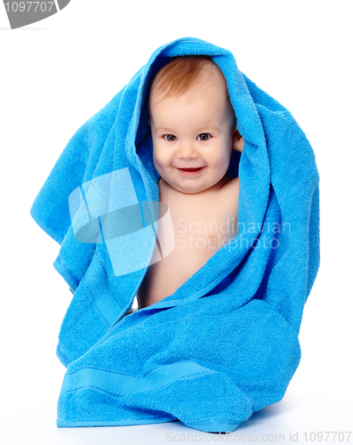 Image of Cute child wrapped in blue towel