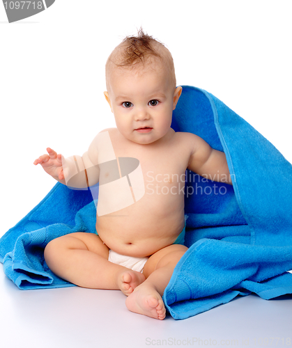 Image of Cute child wrapped in blue towel