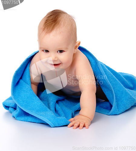 Image of Cute child wrapped in blue towel