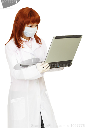 Image of Health worker uses laptop for work