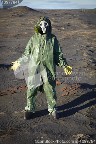 Image of Man in chemical protective suit in desert