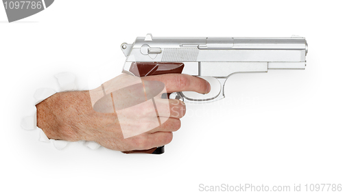 Image of Man's hand holding a large silver handgun